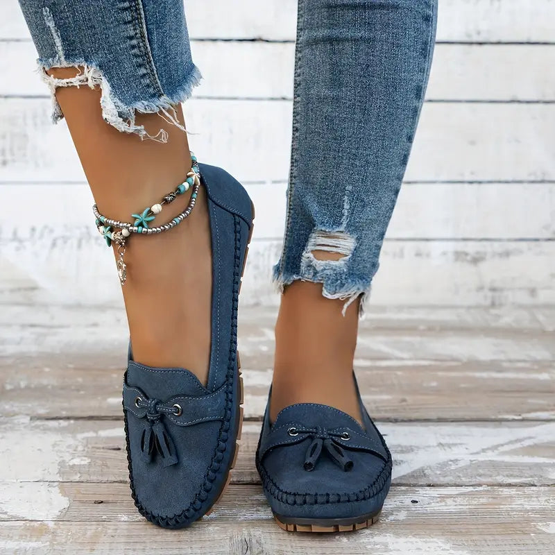 Top view of navy blue vintage loafers displaying moccasin-style stitching and classic silhouette