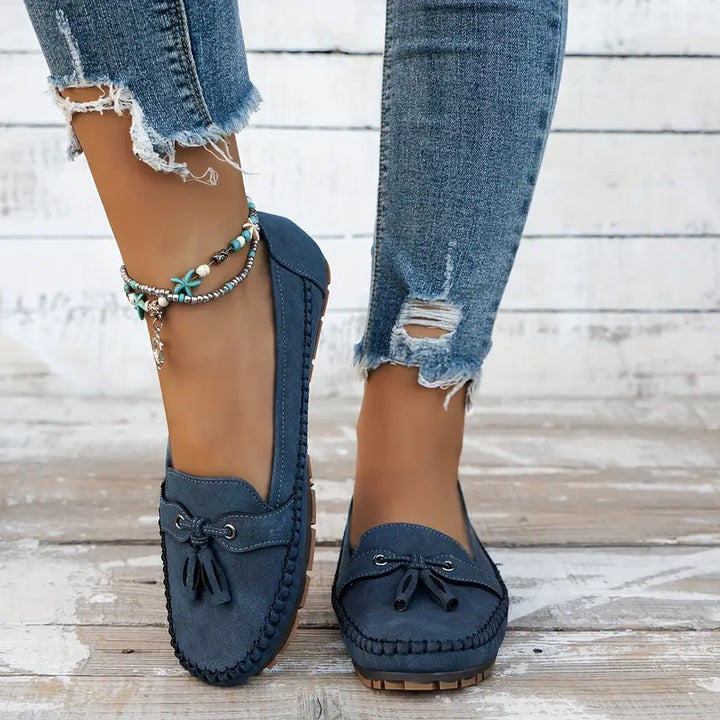 Top view of navy blue vintage loafers displaying moccasin-style stitching and classic silhouette