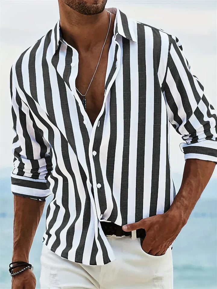 Detail of men's striped shirt cuff and sleeve construction with adjustable button closure