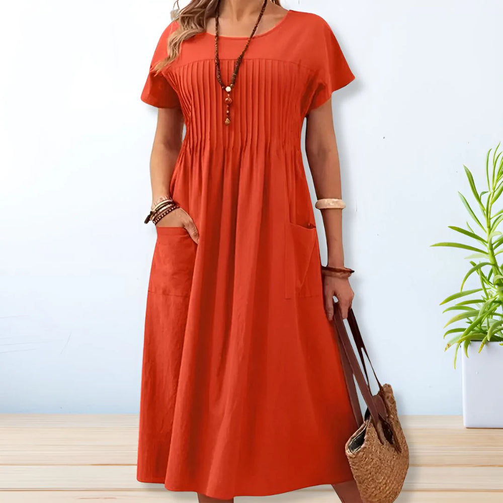 Relaxed fit cotton summer dress with side pockets and short sleeves in olive green color