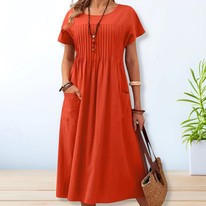 Relaxed fit cotton summer dress with side pockets and short sleeves in olive green color