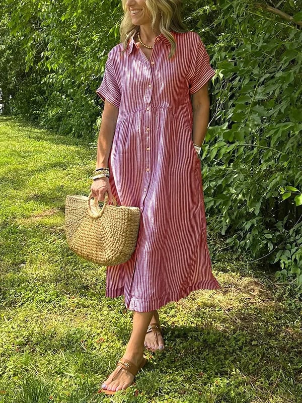 Full-length view of women's striped button-up dress with midi hemline falling below the knee