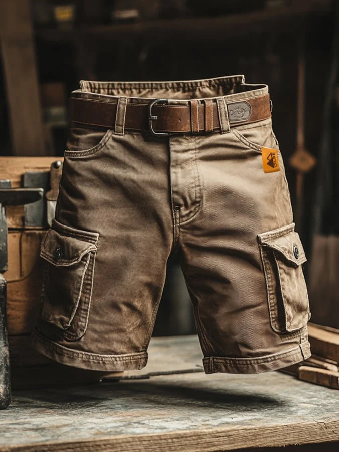 Side view of men's cargo shorts showing flap pocket detail and structured twill fabric with contrast stitching