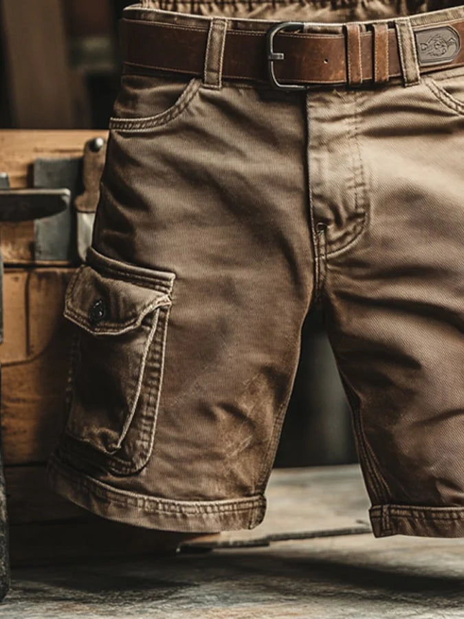 Detail shot of cargo shorts side pocket with flap-and-button closure and visible seam stitching