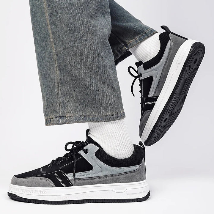 Back view of patchwork sneakers displaying ribbed knit collar and heel tab detail