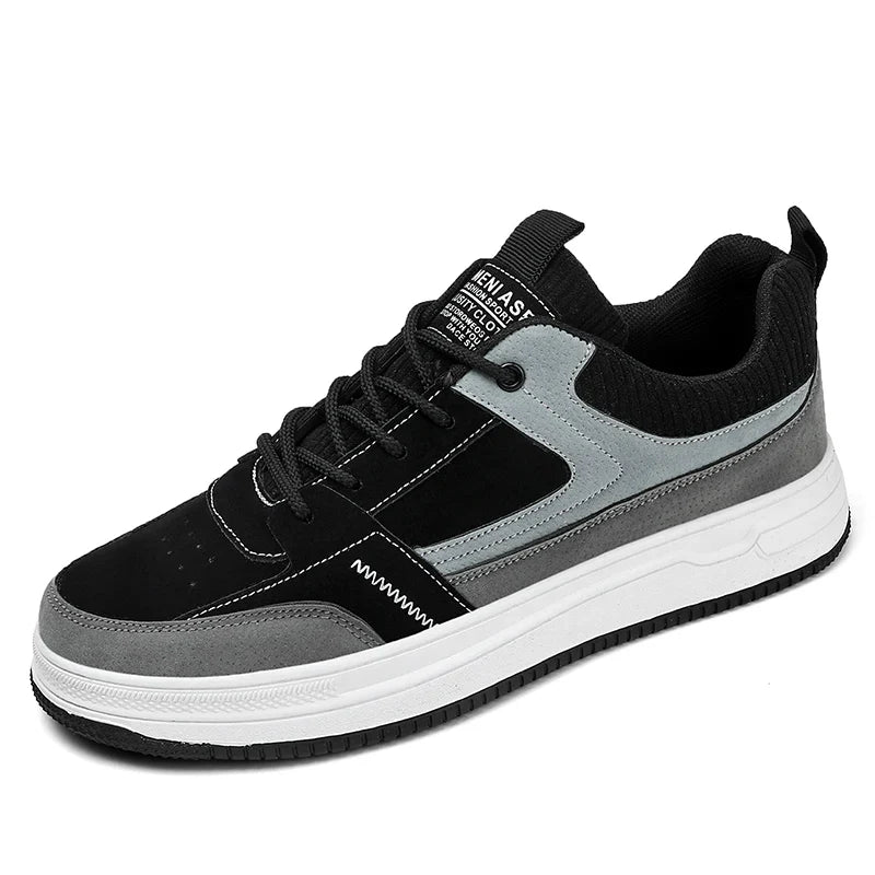 Detail shot of men's patchwork sneakers showing ribbed knit upper and lace closure