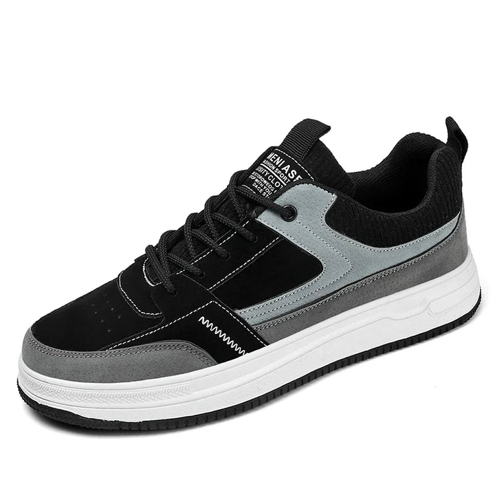 Detail shot of men's patchwork sneakers showing ribbed knit upper and lace closure