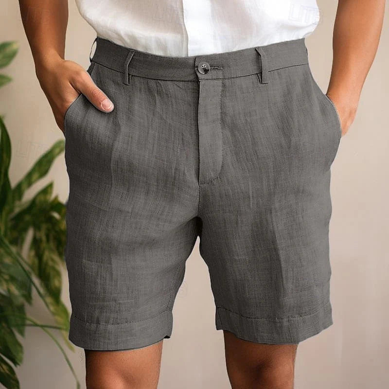Close-up view of men's chino shorts showing structured woven fabric and relaxed fit through the leg