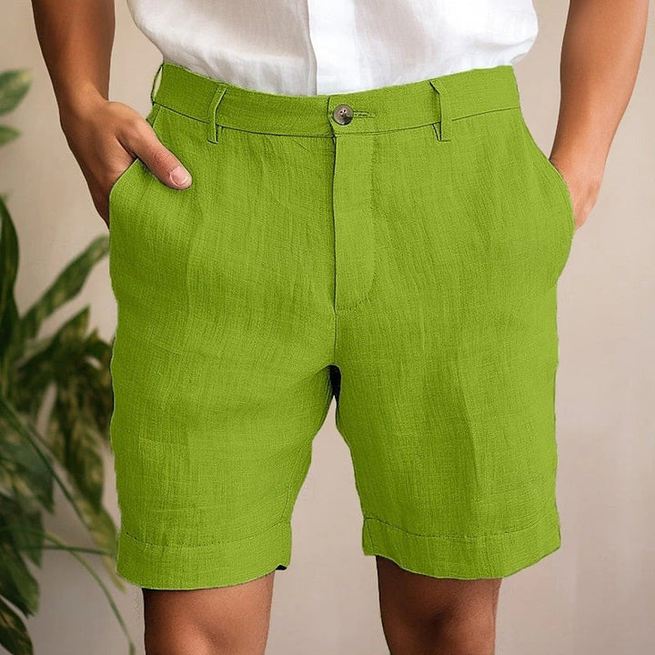 Side view of men's tailored chino shorts displaying functional pockets and mid-rise waistband detail