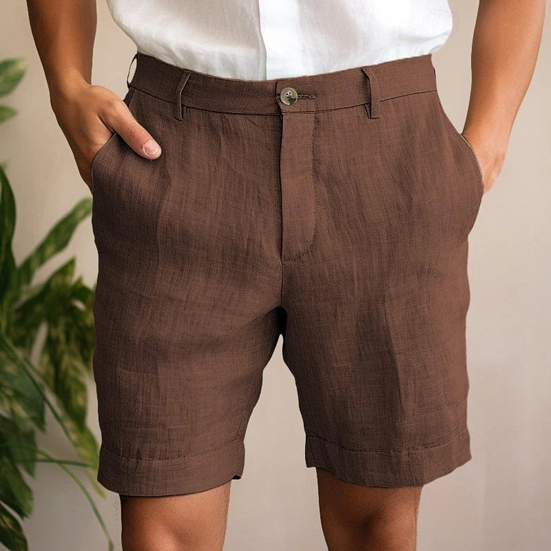 Men's chino shorts with cuffed hem and button closure styled for casual summer occasions