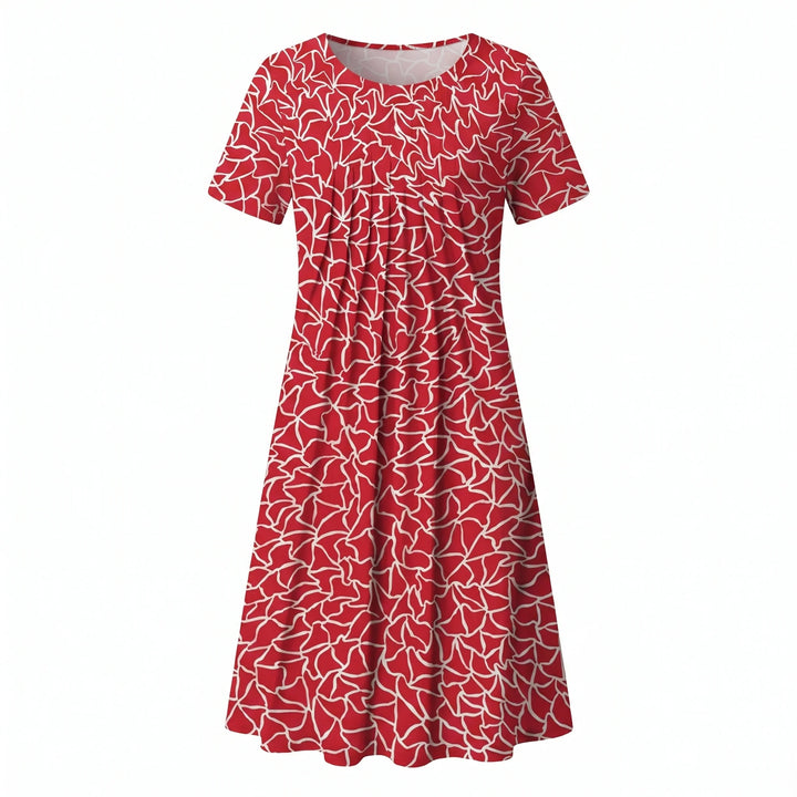 Woman wearing floral midi dress in relaxed standing pose showing fit
