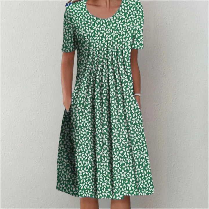 Side profile of floral midi dress showing pleated bodice and waist drape