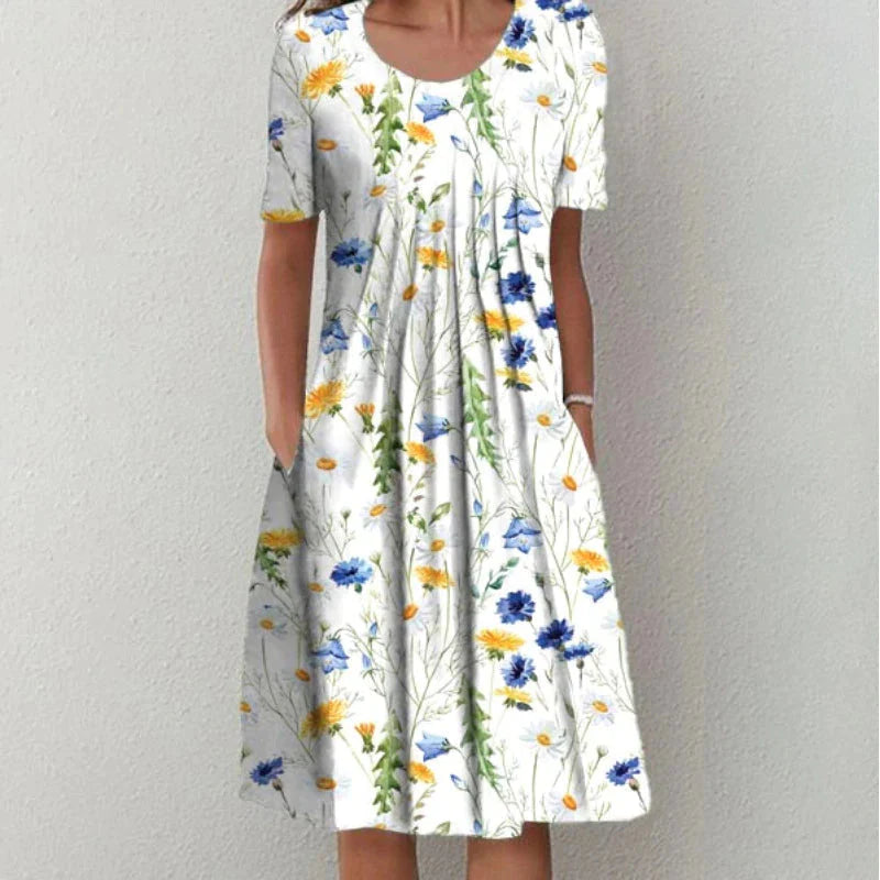 Woman wearing floral midi dress with hand on hip showing silhouette