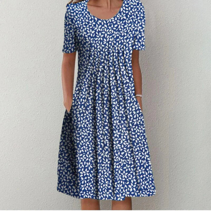 Full-body shot of floral midi dress highlighting A-line fit and length