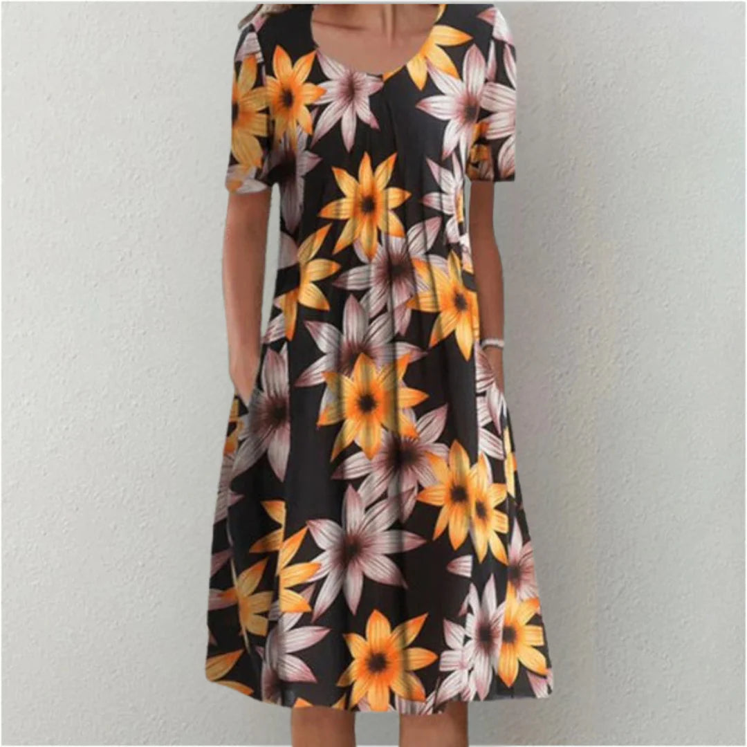 Detail view of floral midi dress neckline and upper bodice construction
