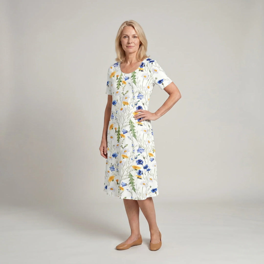 Side angle of floral midi dress showing A-line cut and knee-length hemline