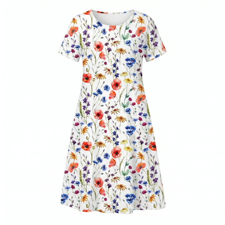 Woman styling floral midi dress with casual footwear for daytime look