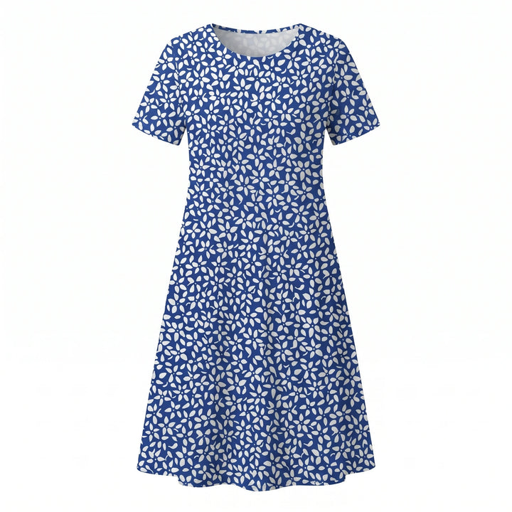 Floral midi dress shown in natural light highlighting print and fabric drape