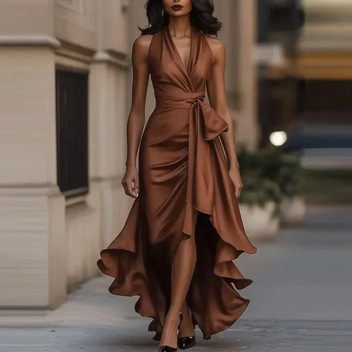 Detail shot of waist tie and ruched bodice on halter satin maxi dress with flattering drape