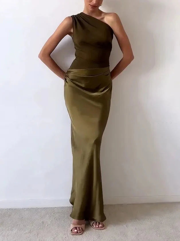 Close up of asymmetric neckline and pleated detailing on one shoulder formal maxi dress