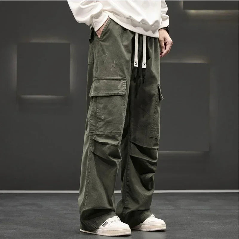 Side view of men's cargo pants showing oversized flap pockets and cuffed hem detail