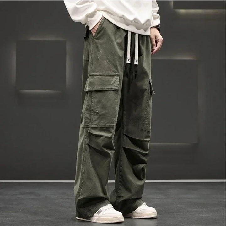 Side view of men's cargo pants showing oversized flap pockets and cuffed hem detail