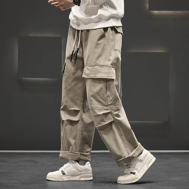Men's wide leg cargo pants styled with white sneakers for casual streetwear look