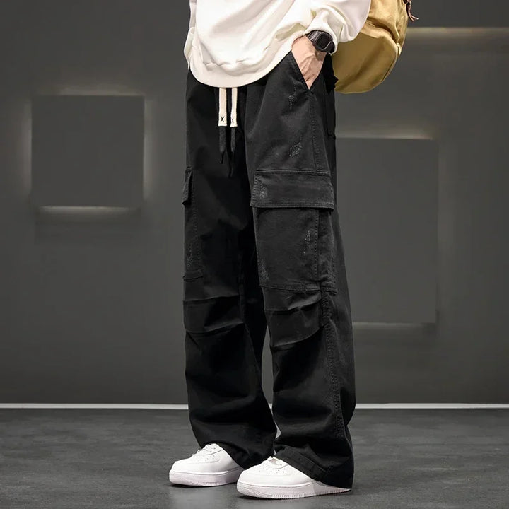 Full length view of men's relaxed fit cargo pants with mid-rise waist and belt loops