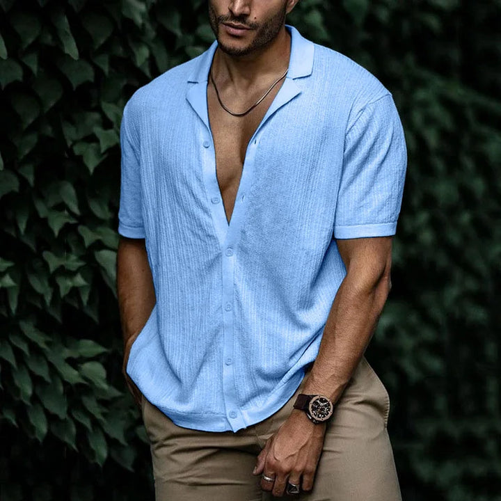 Side view of men's camp collar shirt showing relaxed fit and short sleeve construction