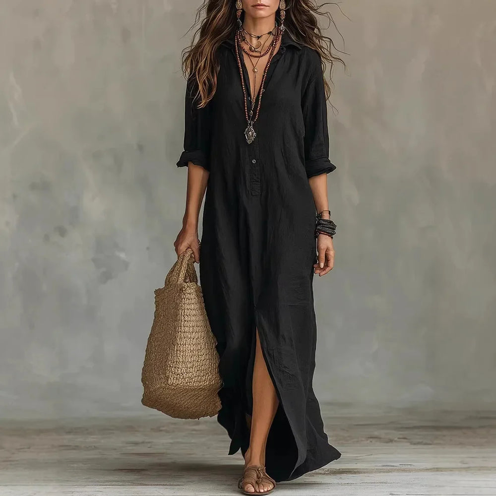 Side view of the kaftan linen long shirt dress showing flowing silhouette and three-quarter sleeves with roll-tab detail