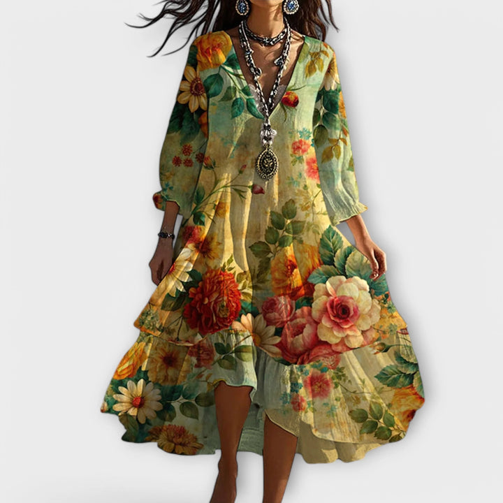 Floral midi dress with V-neckline, 3/4 sleeves, and tiered ruffled hem in botanical print