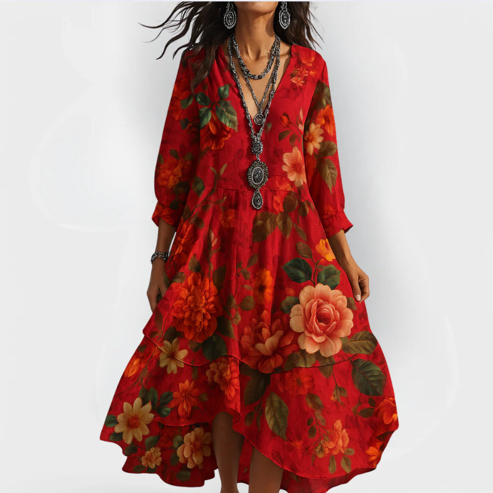 Close-up view of floral midi dress showing V-neck detail and three-quarter sleeve construction