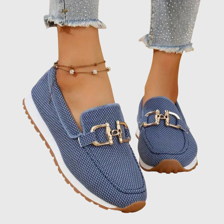 Women's orthopedic loafers in blue textured canvas with gold-tone horsebit hardware and white rubber sole