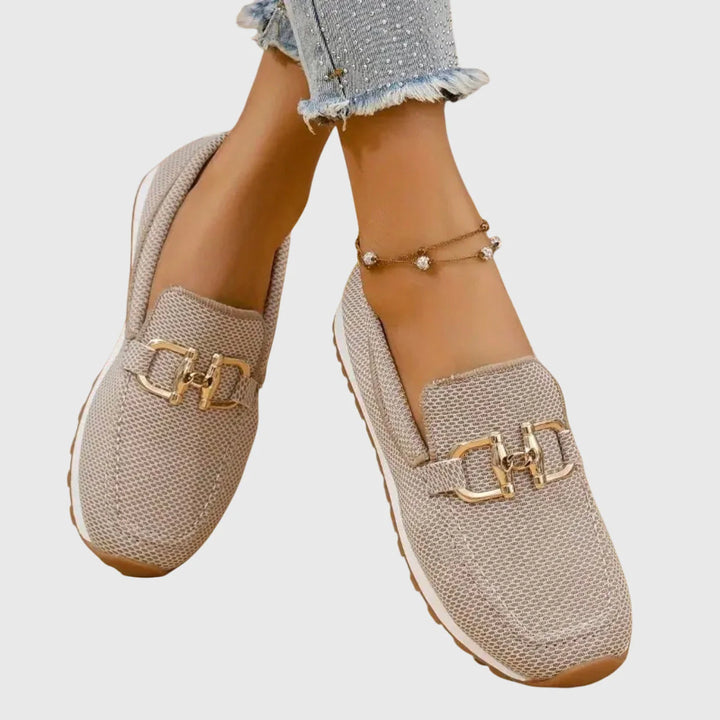 Side view of women's blue orthopedic loafers showing slip-on design and contrast white midsole with tread