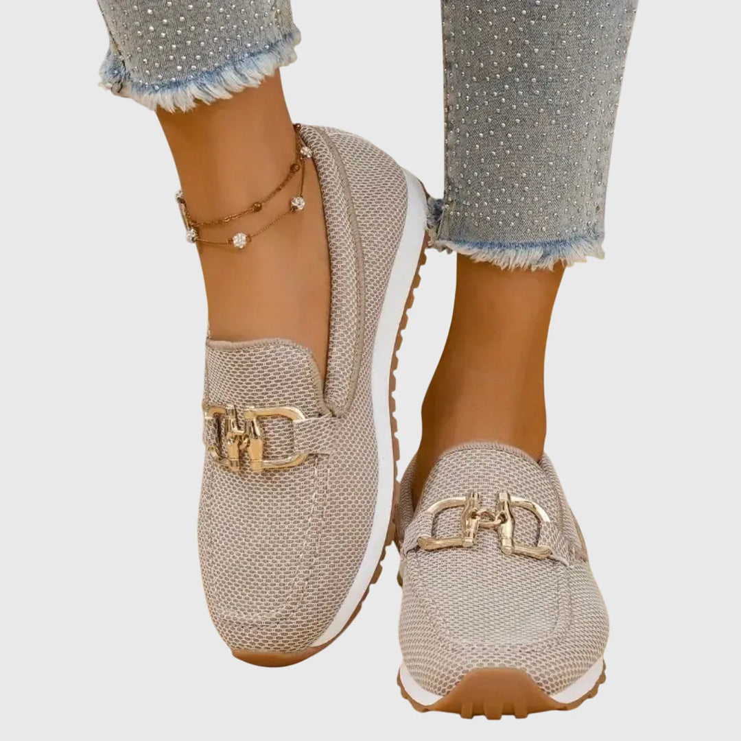 Pair of women's orthopedic loafers displaying textured canvas finish and contrast white rubber midsole