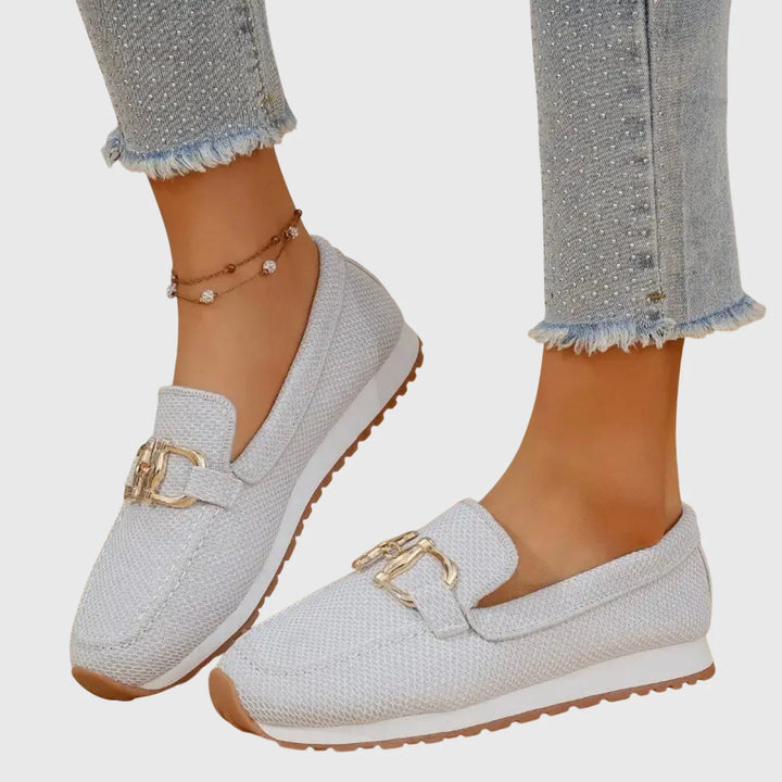 Women's orthopedic loafers styled with embellished denim showing versatile casual footwear option