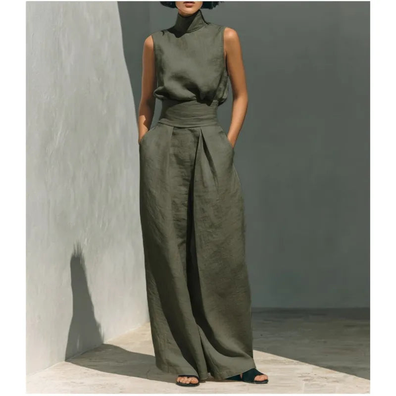 Close up of draped stand collar and sleeveless design on high waist jumpsuit