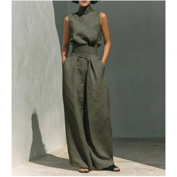 Close up of draped stand collar and sleeveless design on high waist jumpsuit