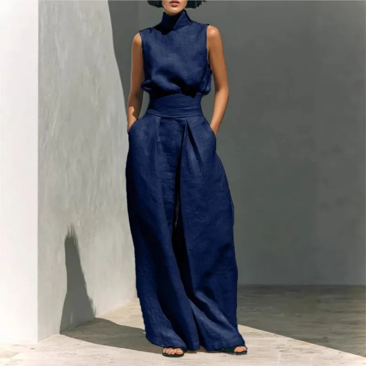 Full length view of wide leg high waist jumpsuit with front pockets and textured fabric
