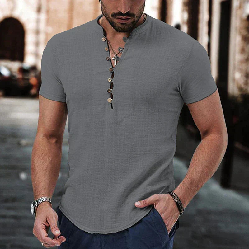 Close-up view of the textured fabric and structured henley neckline on men's casual shirt