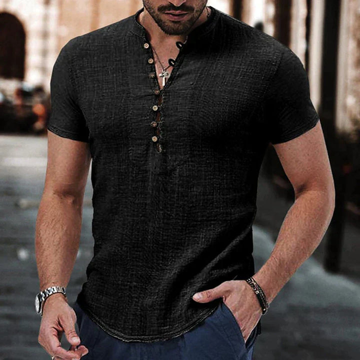 Side angle showing the relaxed fit and curved hem of the breathable linen henley shirt