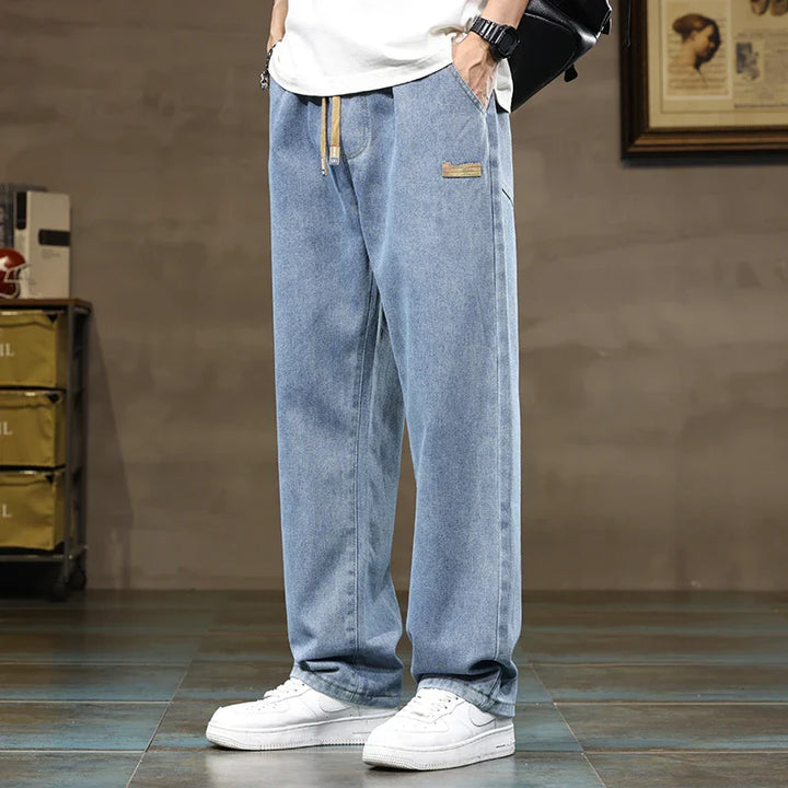 Back view of men's straight leg jeans showing wide leg opening and relaxed fit through seat