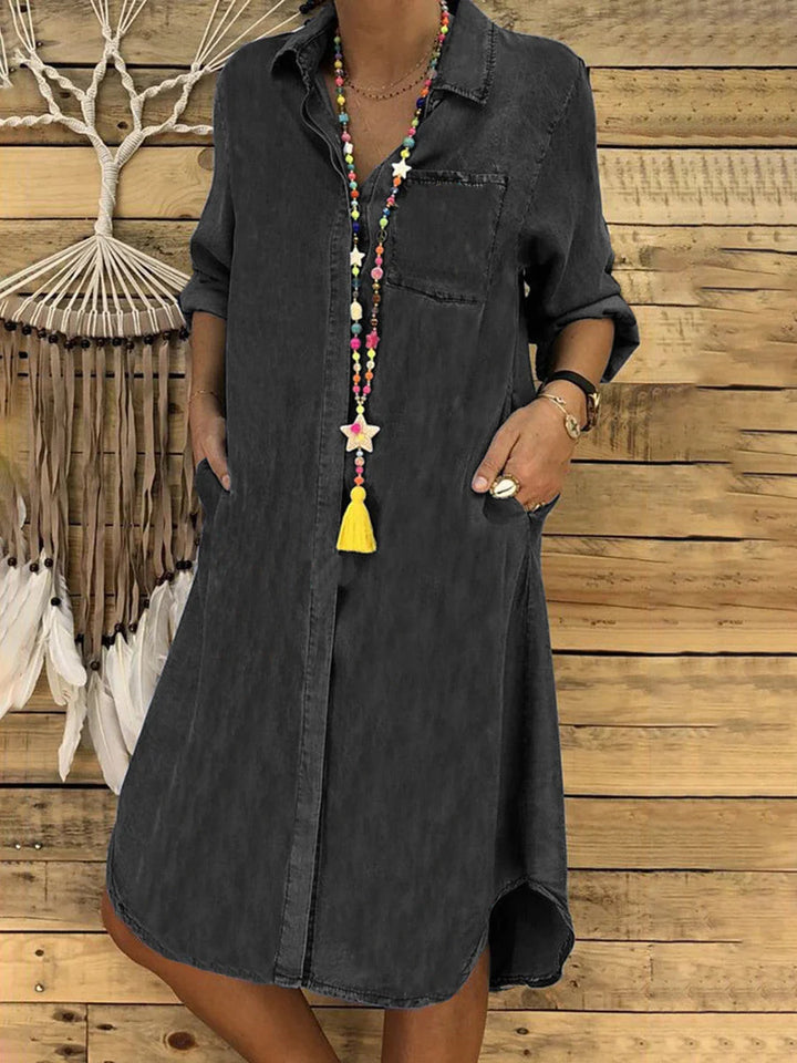Woman wearing a charcoal Denim Shirt Dress with button-down front and relaxed fit silhouette