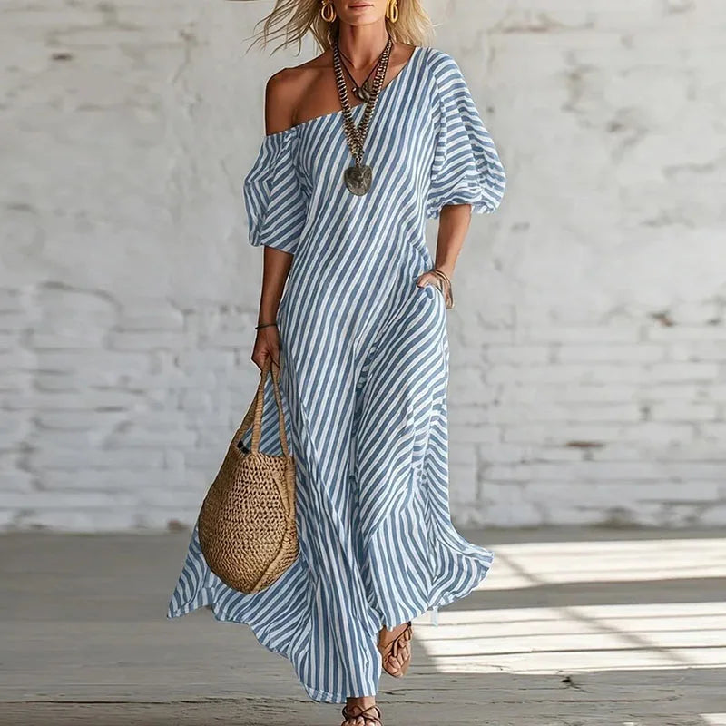 Full-length view of striped one shoulder dress with ankle-grazing hem and A-line cut