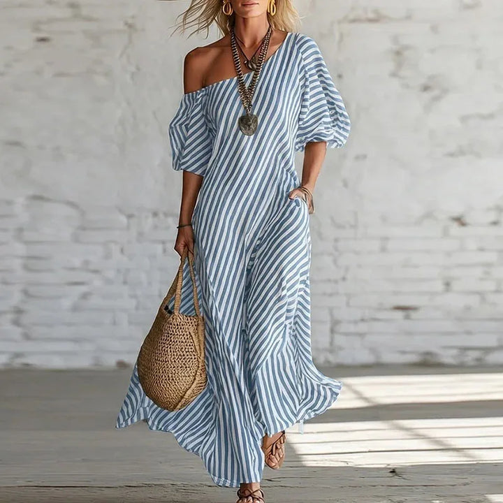 Full-length view of striped one shoulder dress with ankle-grazing hem and A-line cut