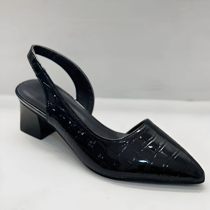 Side view of black slingback heels with arch support and cushioned insole design