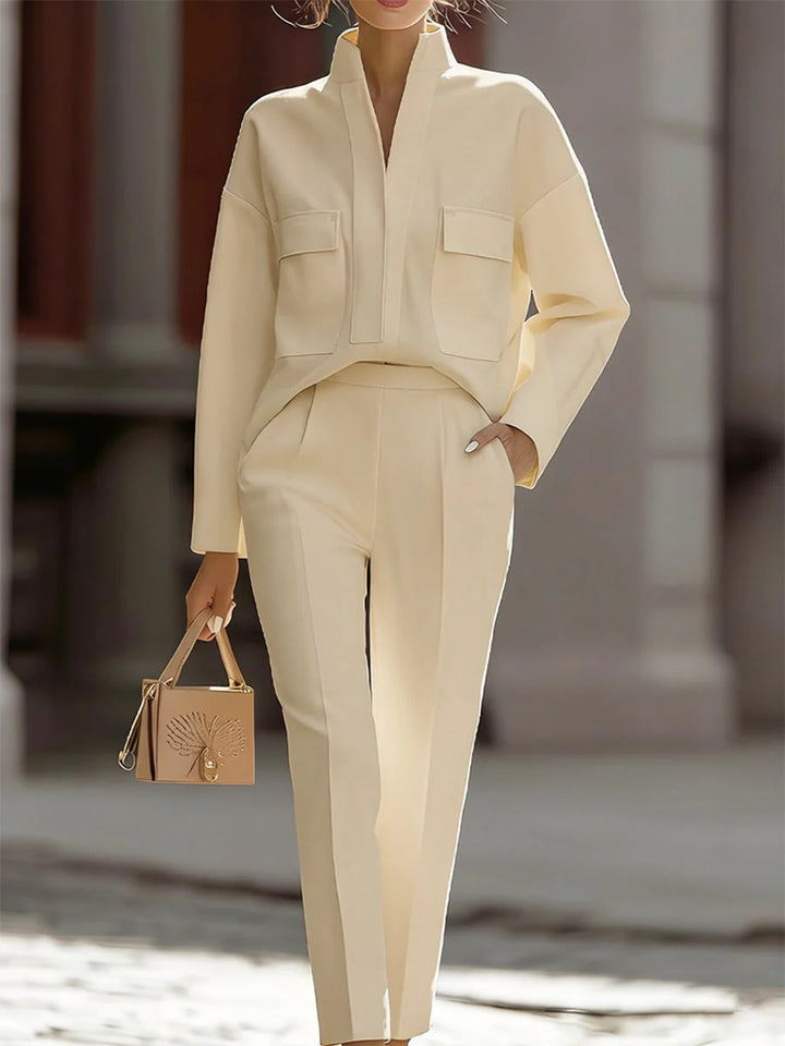 Front view of coordinated two-piece set featuring structured oversized shirt and cropped trousers in ivory