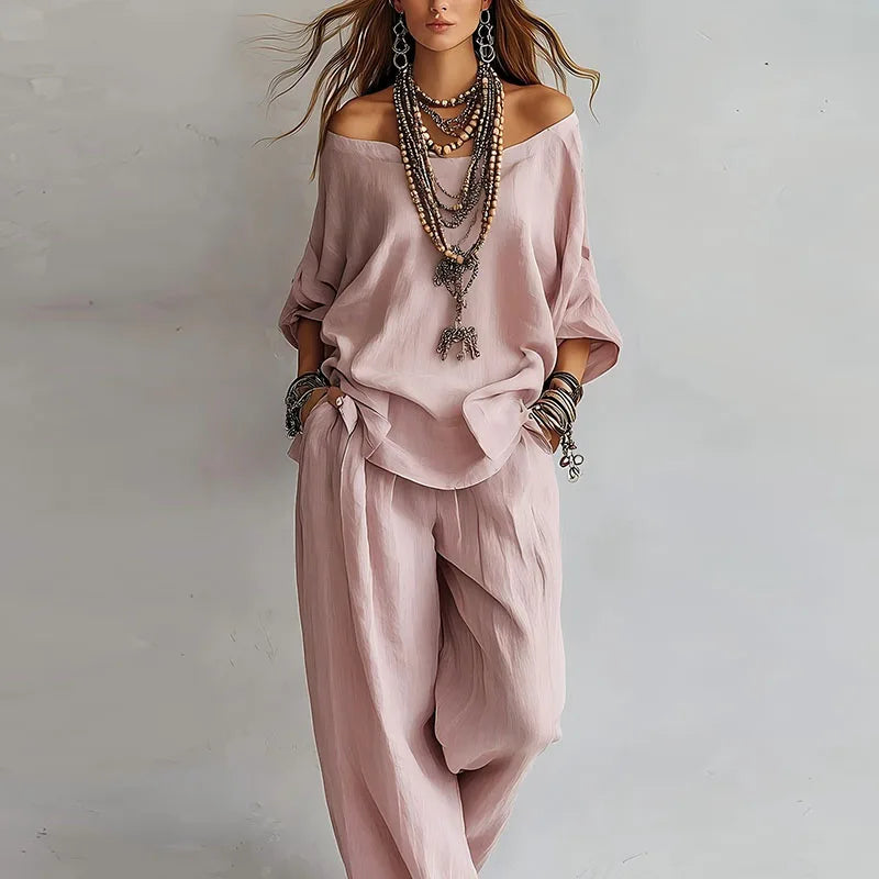 Woman wearing relaxed off shoulder co-ord set with wide-leg pants in soft pink shade