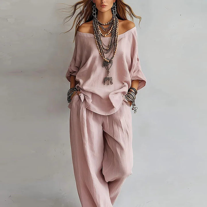 Woman wearing relaxed off shoulder co-ord set with wide-leg pants in soft pink shade
