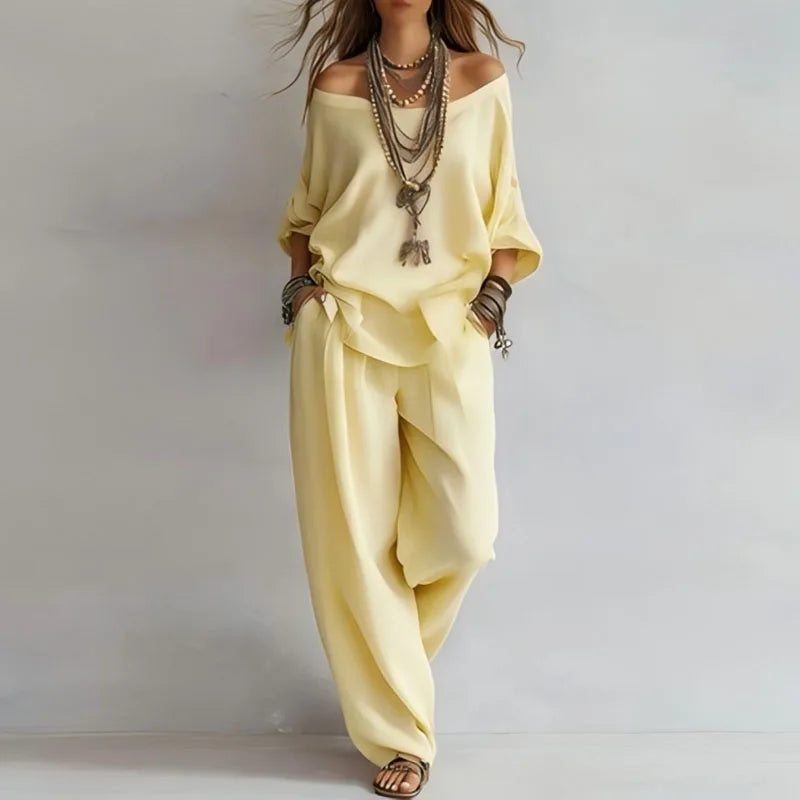 Side angle showing wide-leg trousers and loose silhouette of two-piece co-ord set